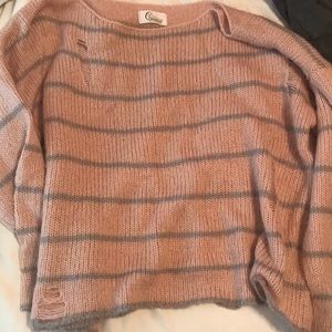 pink and grey striped ripped sweater
